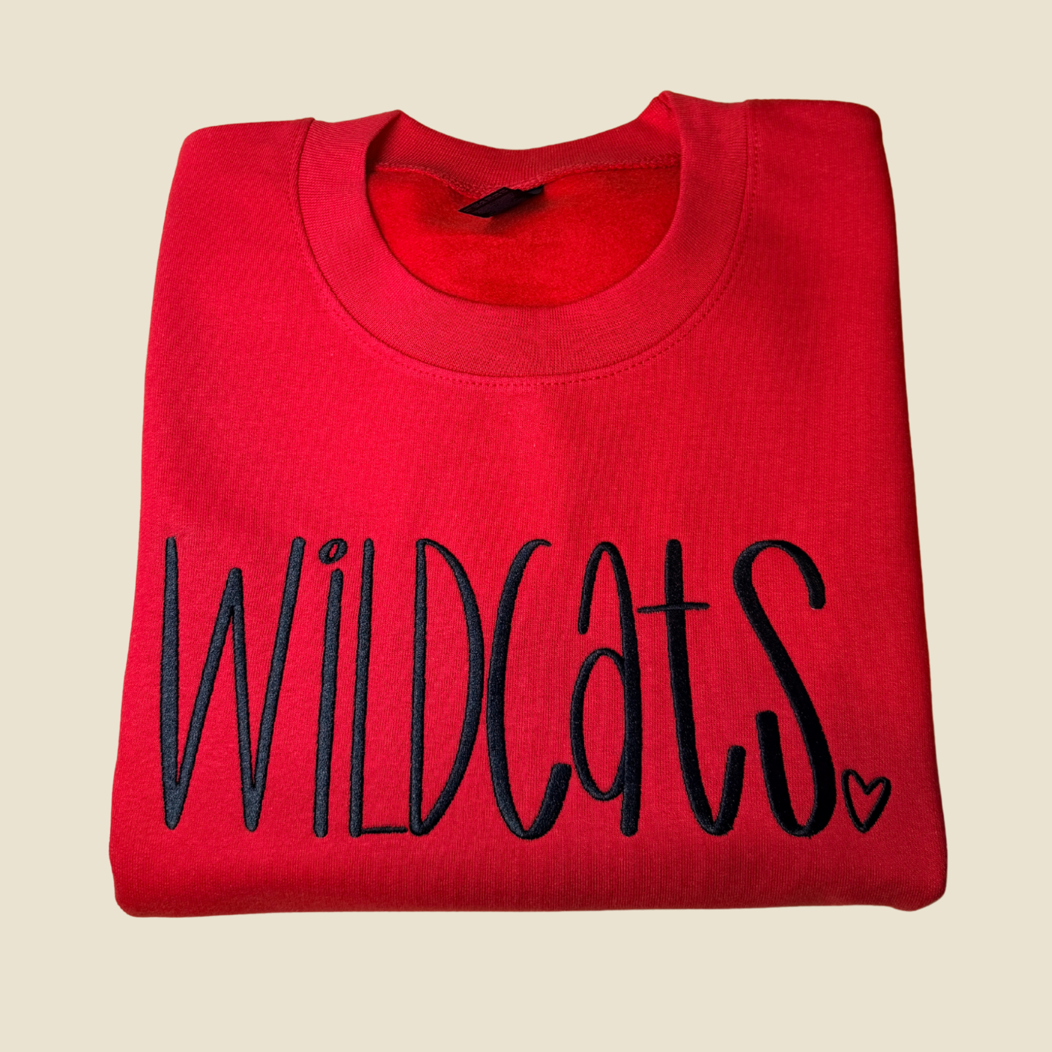 School spirit, stitched to last.
This embroidered crewneck features a bold Wildcats script with a subtle heart detail, creating a timeless piece that feels spirited without being loud. Clean lines, intentional stitching, and a cozy fit make this an easy grab for game days, school events, or everyday wear.