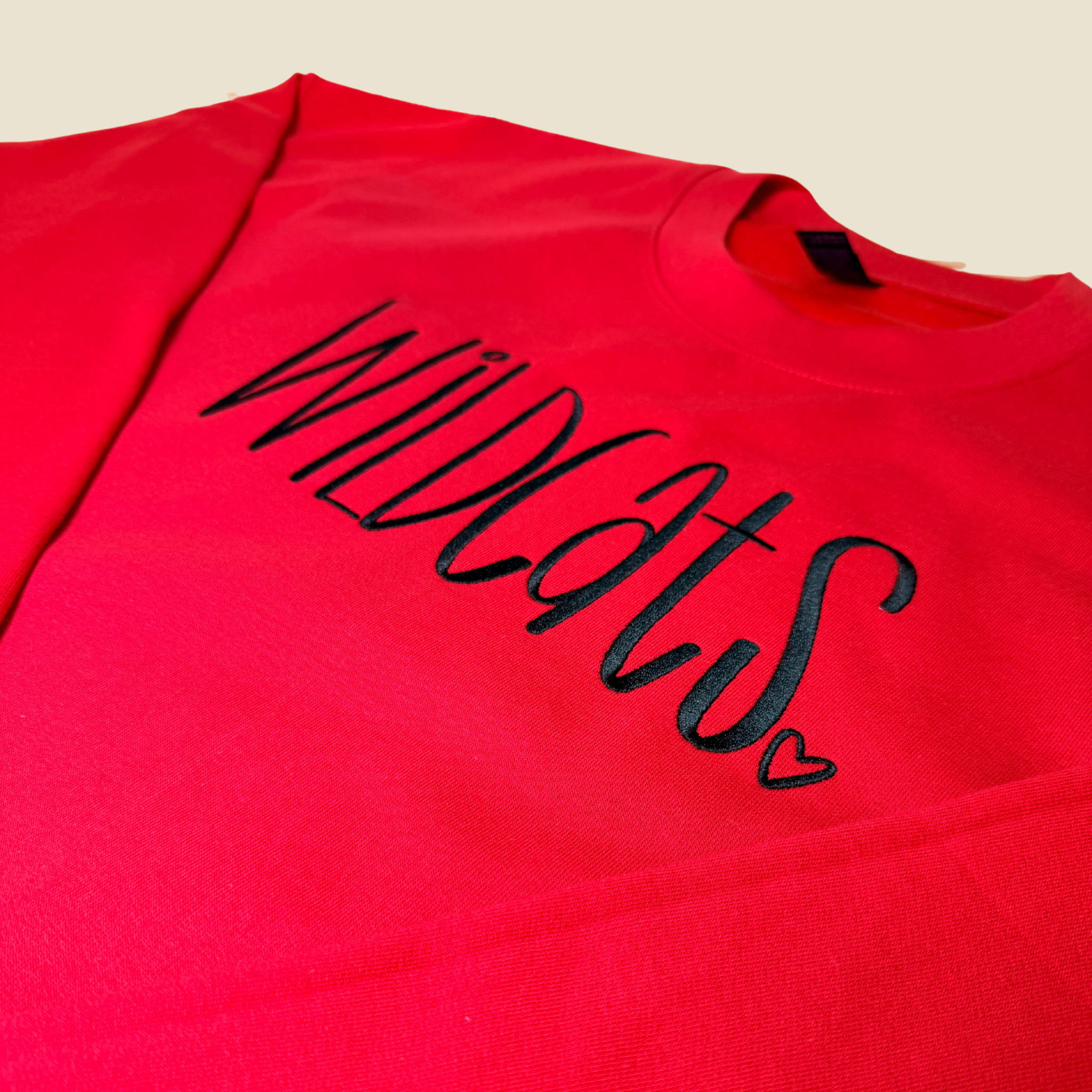 School spirit, stitched to last.
This embroidered crewneck features a bold Wildcats script with a subtle heart detail, creating a timeless piece that feels spirited without being loud. Clean lines, intentional stitching, and a cozy fit make this an easy grab for game days, school events, or everyday wear.