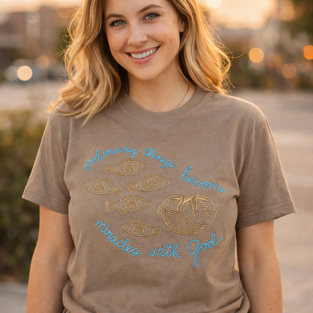 Woman wearing a brown t-shirt with a motivational quote outdoors