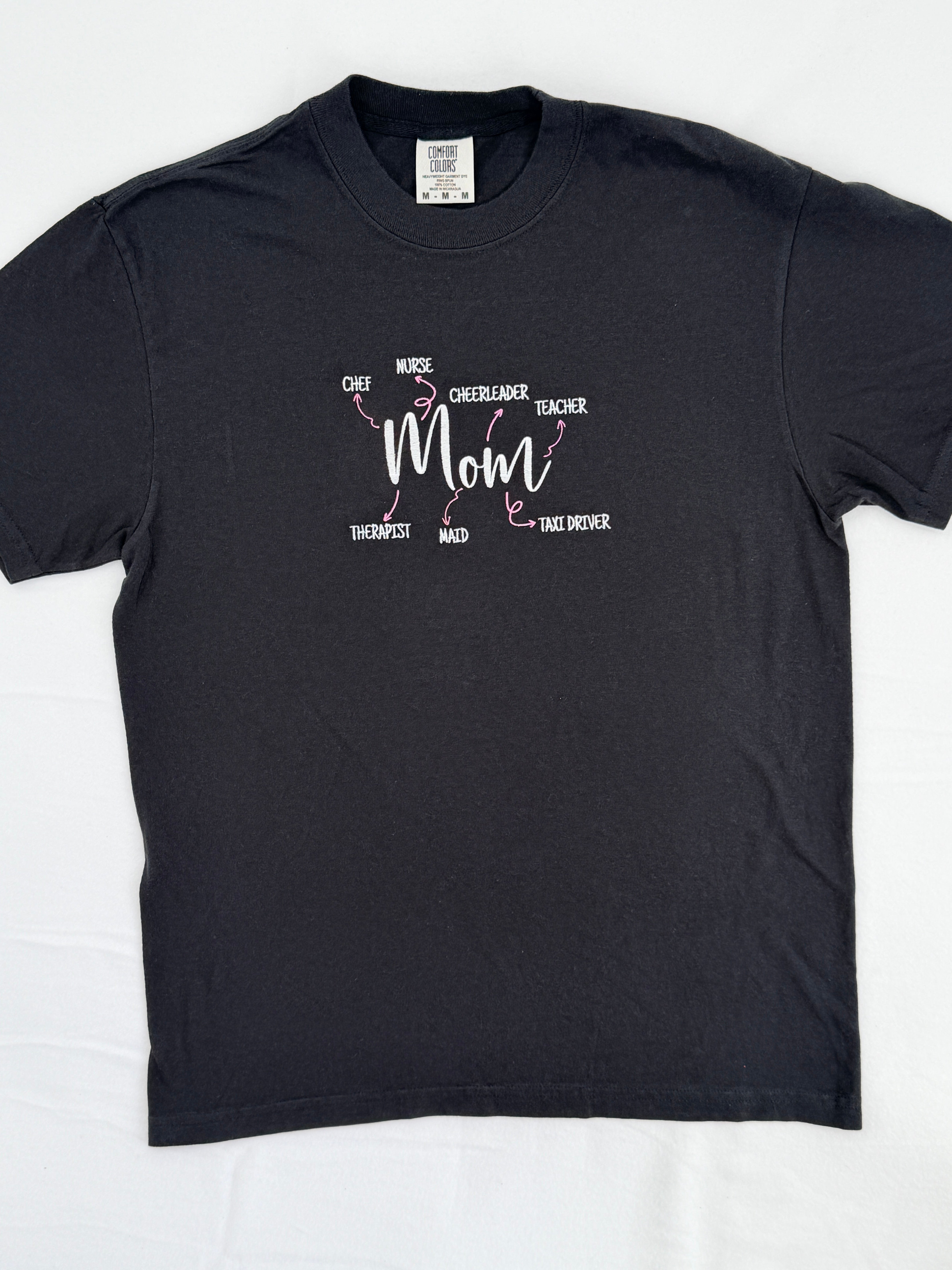Black t-shirt with text design on a white background