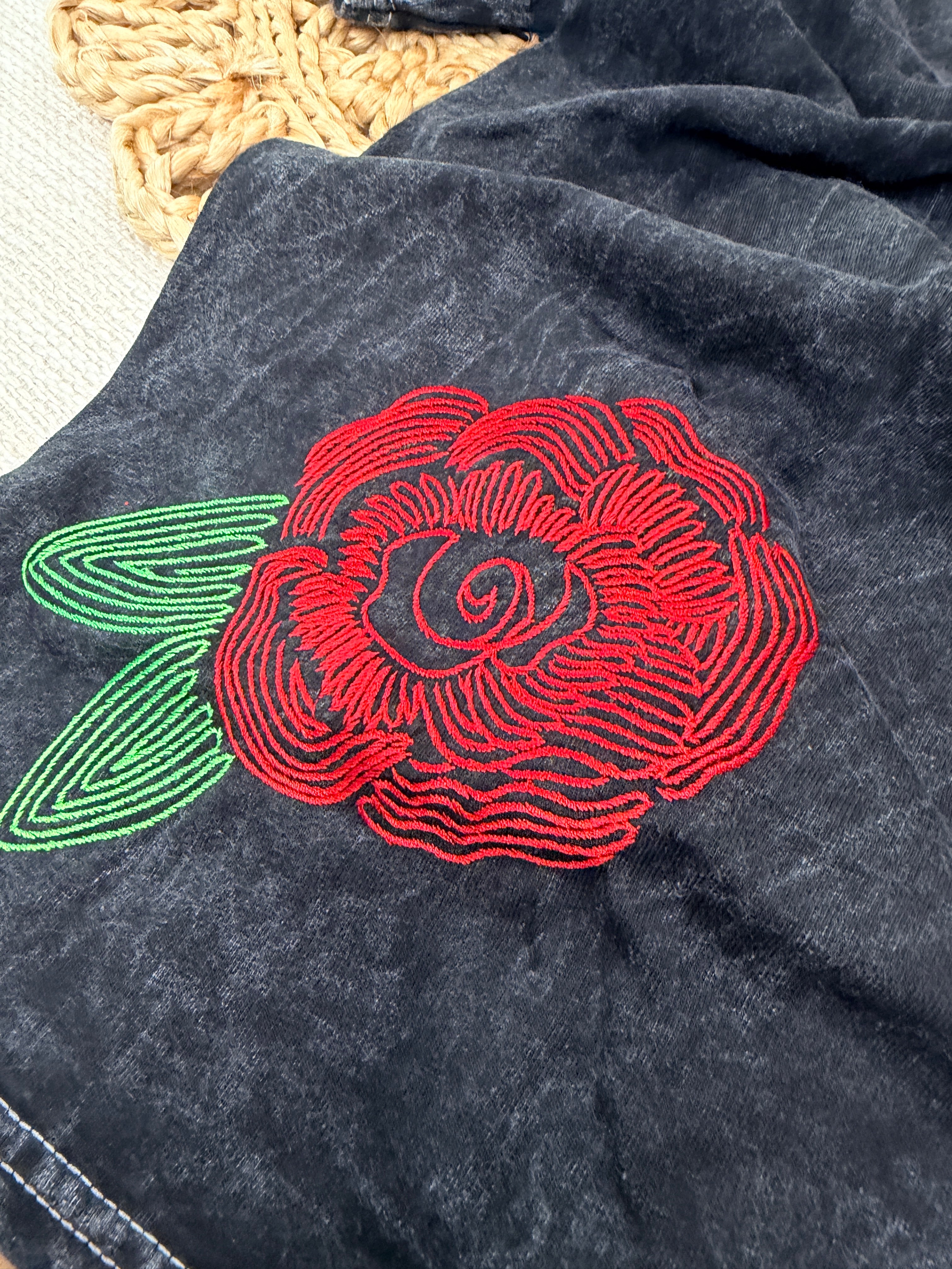 A washed black canvas with story stitched into every detail. The Midnight Bloom Tour Tee is designed to feel like something collected over time—soft, worn, and quietly striking. Three thoughtfully placed embroidery moments create movement across the garment, giving it that imperfect, artful balance that feels both elevated and undone.